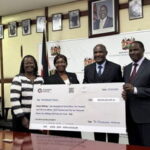 john-mbadi-recieving-cheque