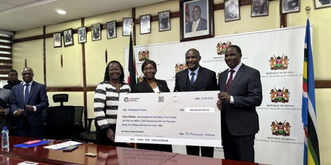 john-mbadi-recieving-cheque