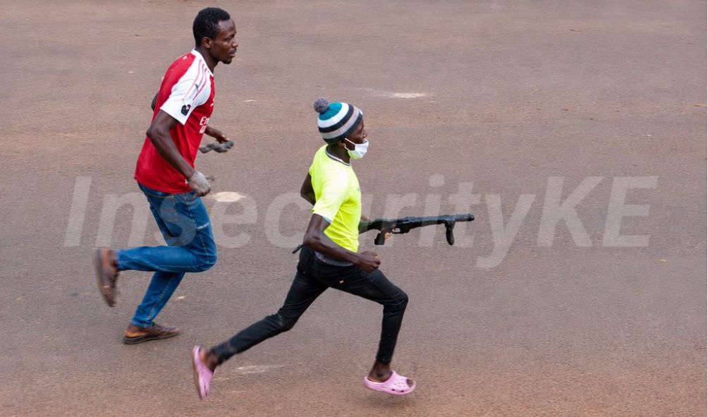 [VIDEO] Protester Runs Away With Grenade Launcher, Police Begin Manhunt